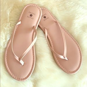 Tan flip flops